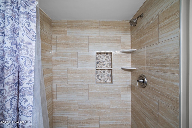 bathroom featuring curtained shower