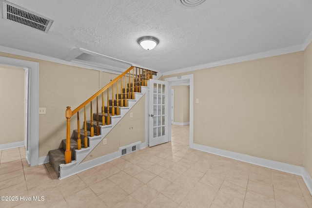 basement featuring a textured ceiling