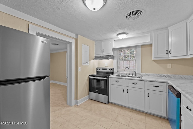 kitchen with sink, light stone counters, a textured ceiling, white cabinets, and appliances with stainless steel finishes