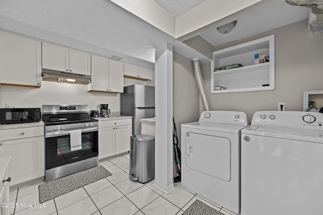 kitchen with white cabinets, independent washer and dryer, a textured ceiling, and stainless steel appliances