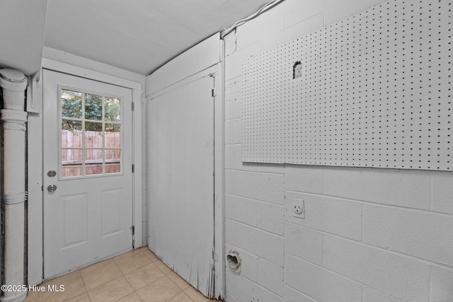 doorway featuring light tile patterned floors