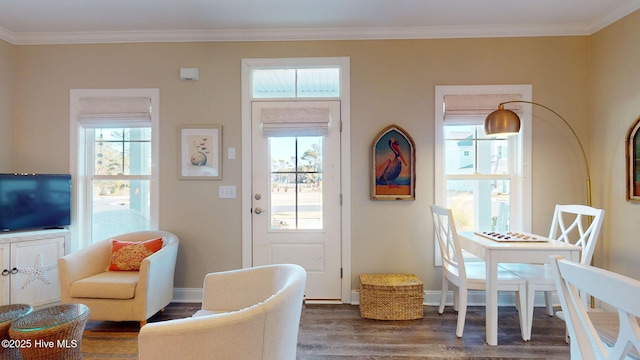 doorway featuring crown molding and dark hardwood / wood-style flooring