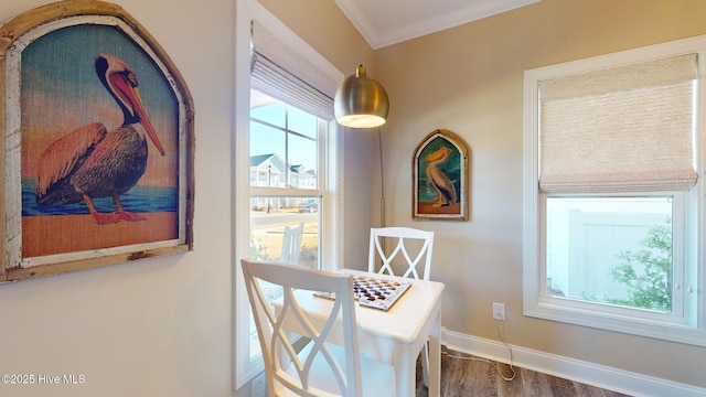 interior space featuring hardwood / wood-style flooring and crown molding