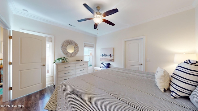 bedroom with ceiling fan, crown molding, and dark wood-type flooring