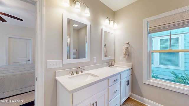 bathroom featuring ceiling fan and vanity