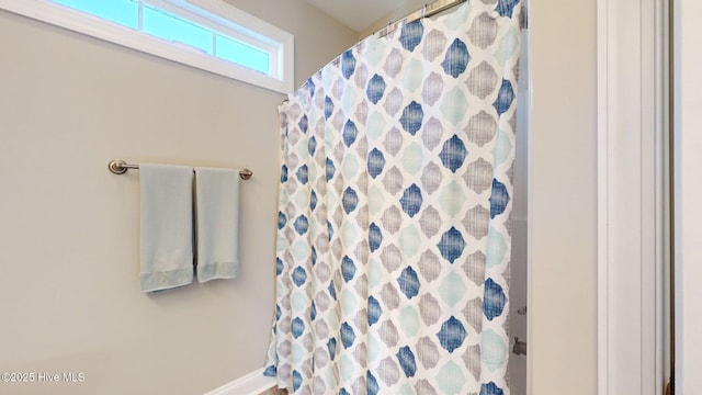 bathroom with a shower with shower curtain