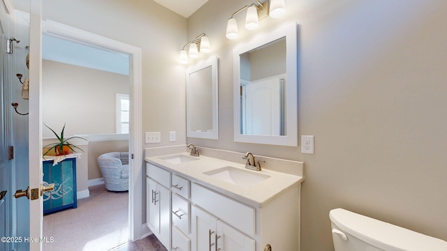 bathroom with vanity and toilet