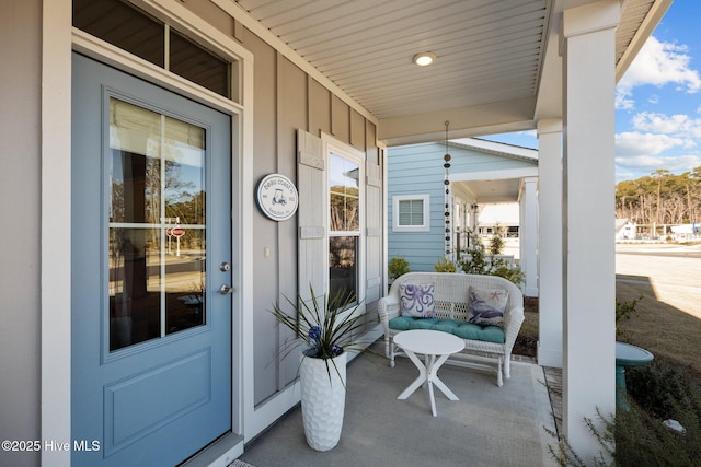 doorway to property featuring covered porch