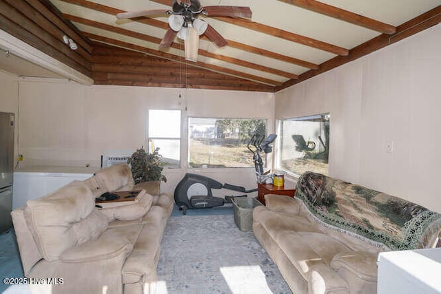 living room featuring vaulted ceiling with beams and ceiling fan