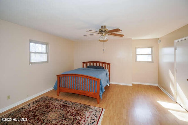 bedroom featuring ceiling fan and light hardwood / wood-style floors