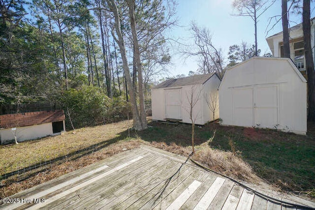 wooden terrace featuring a storage shed