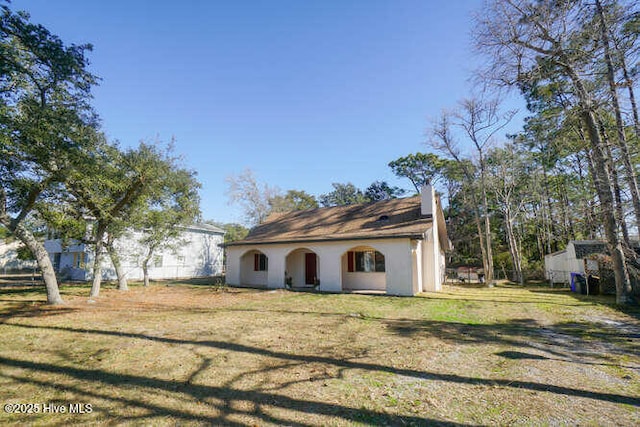 exterior space with a front yard