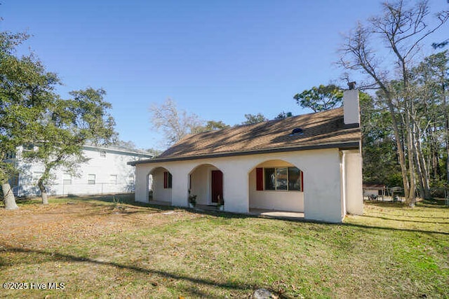 exterior space with a front yard