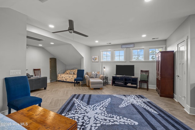 living room featuring ceiling fan, lofted ceiling, and light parquet floors