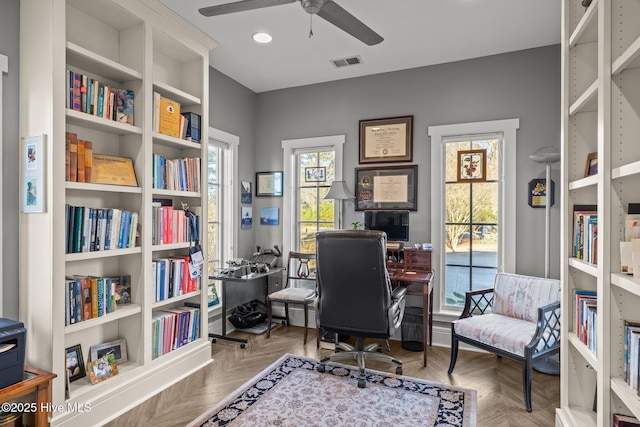 office area featuring ceiling fan and light parquet flooring