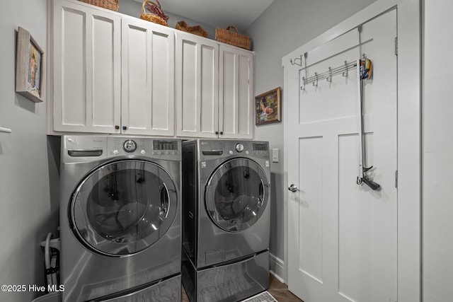 laundry area featuring cabinets and separate washer and dryer