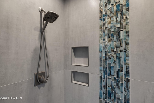 bathroom with tiled shower