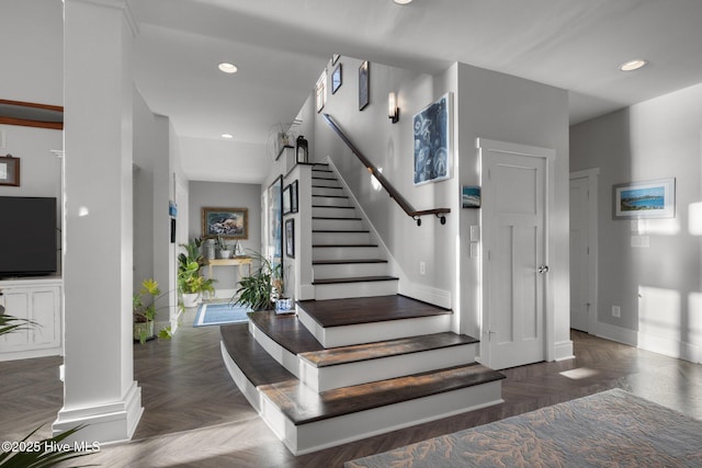 staircase with parquet flooring