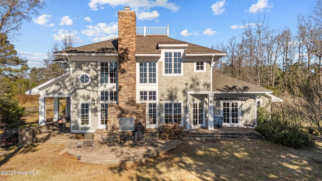 back of house featuring french doors and a patio