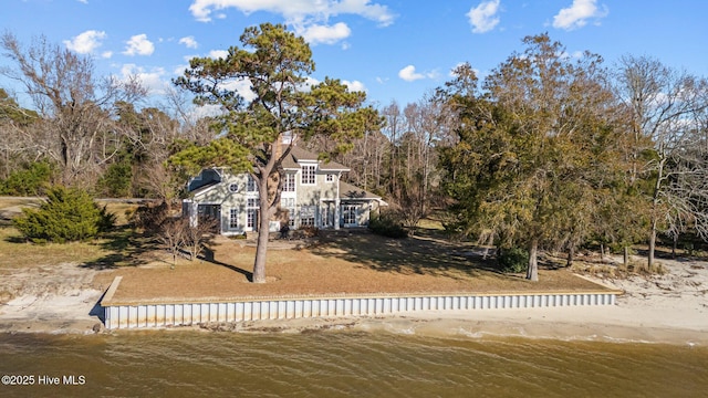 rear view of property featuring a water view