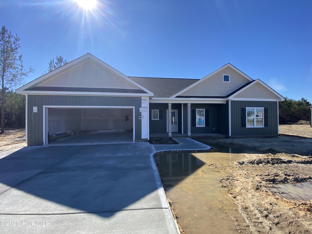 ranch-style house featuring a garage