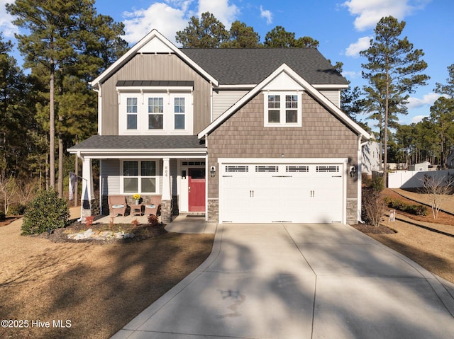 craftsman house featuring covered porch and a garage