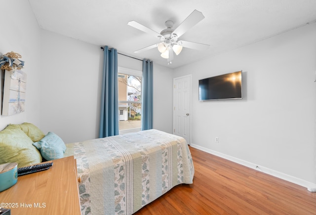 bedroom featuring ceiling fan and hardwood / wood-style floors