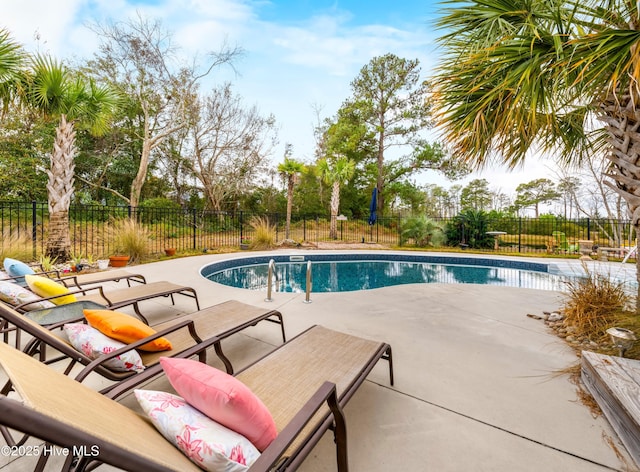 view of swimming pool featuring a patio