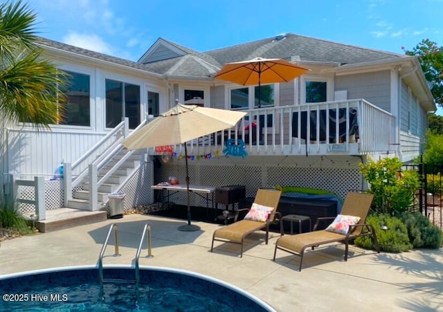 rear view of house with a patio