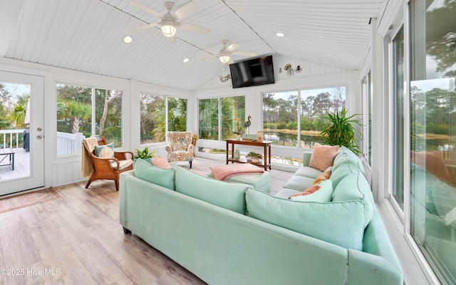 sunroom with ceiling fan, lofted ceiling, and wooden ceiling