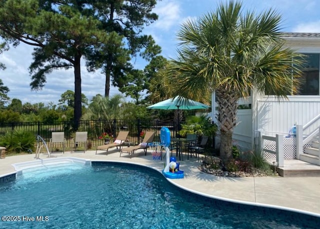 view of swimming pool featuring a patio