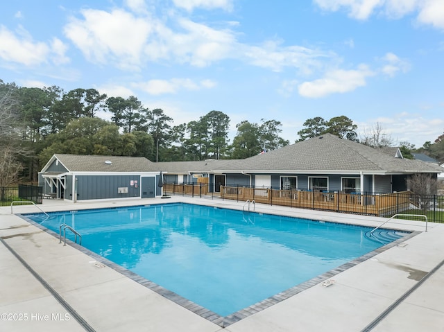 view of swimming pool with a patio area