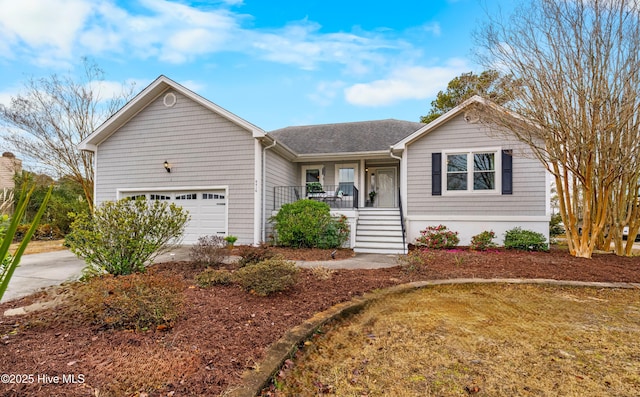 single story home with a porch and a garage