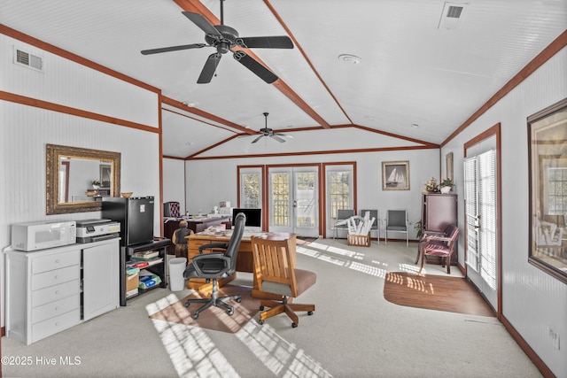 carpeted home office featuring french doors, vaulted ceiling, plenty of natural light, and ceiling fan