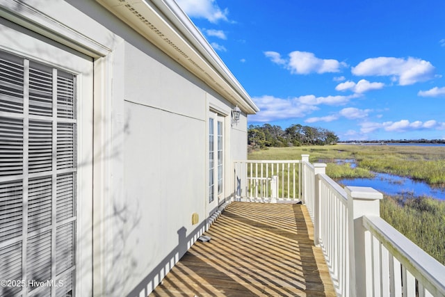 balcony featuring a water view