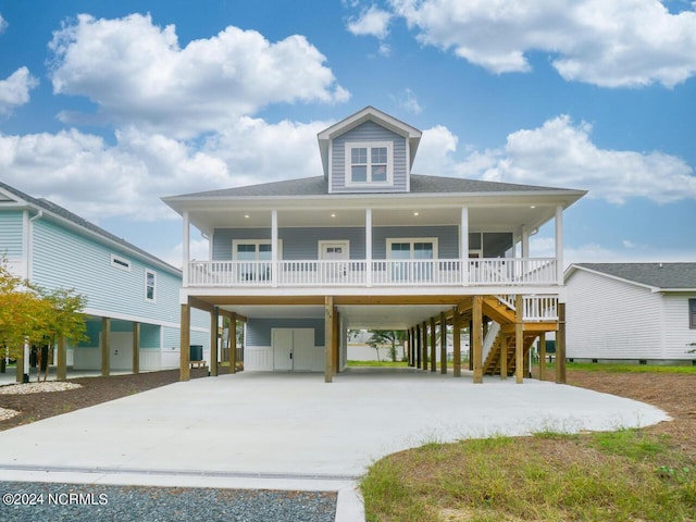 coastal home with a porch and a carport