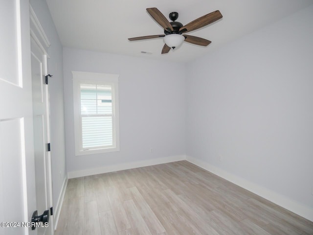 unfurnished room with ceiling fan and light hardwood / wood-style flooring