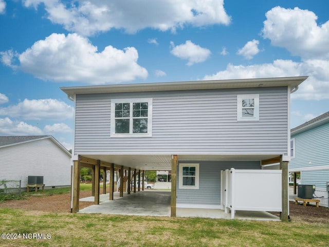 rear view of property featuring central air condition unit