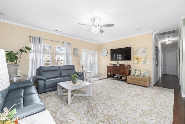 living room featuring crown molding, light hardwood / wood-style floors, and ceiling fan