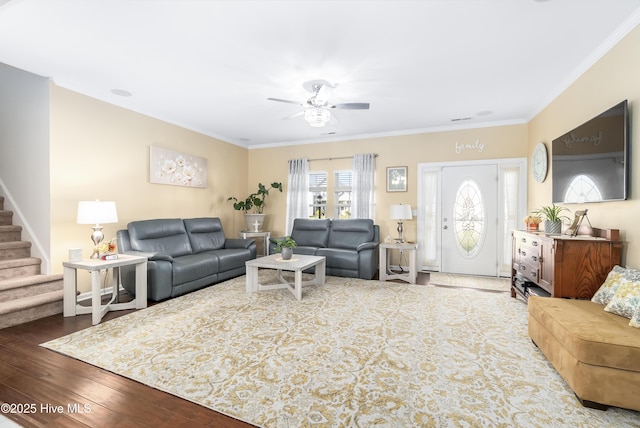 living room featuring crown molding, hardwood / wood-style floors, and ceiling fan