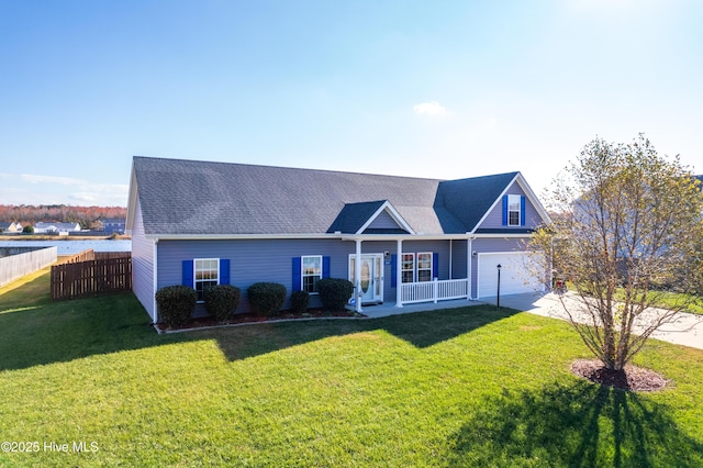 view of front of property with a front yard, a porch, and a garage