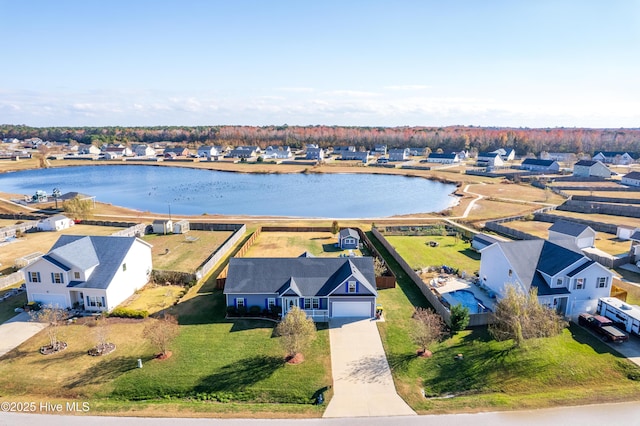 birds eye view of property with a water view