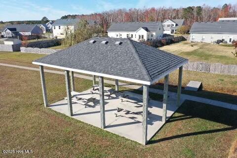 view of community with a lawn and a gazebo