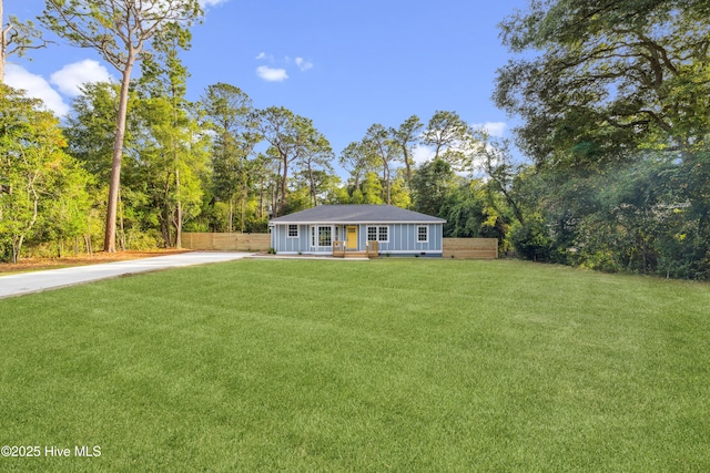 single story home with covered porch and a front lawn