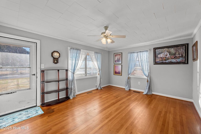 interior space with crown molding, light hardwood / wood-style flooring, and ceiling fan