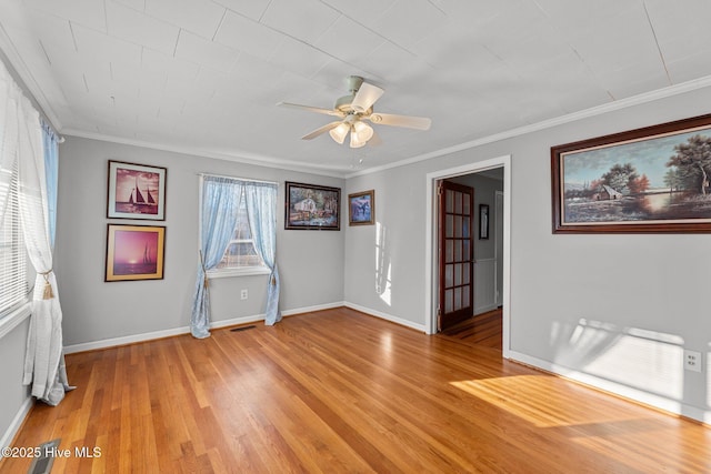 unfurnished room featuring ceiling fan, light hardwood / wood-style floors, and crown molding