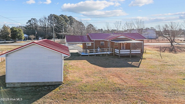 rear view of property with a yard