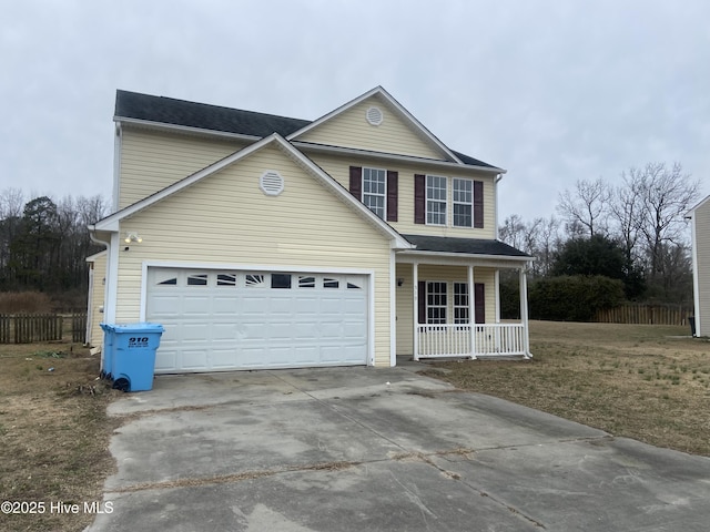 view of property with a garage and covered porch