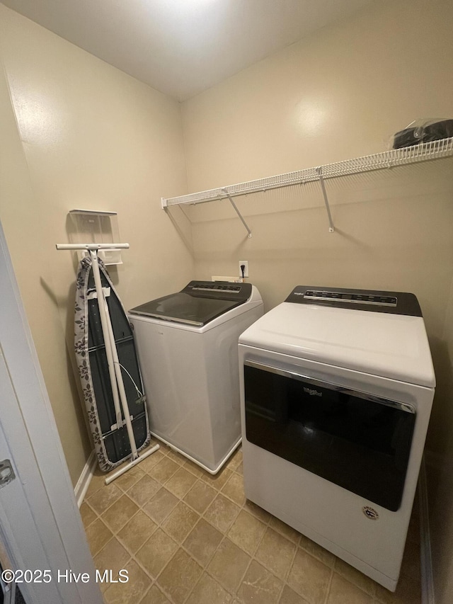 clothes washing area featuring washing machine and dryer