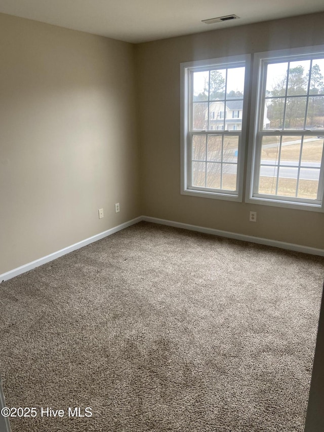 empty room featuring carpet floors